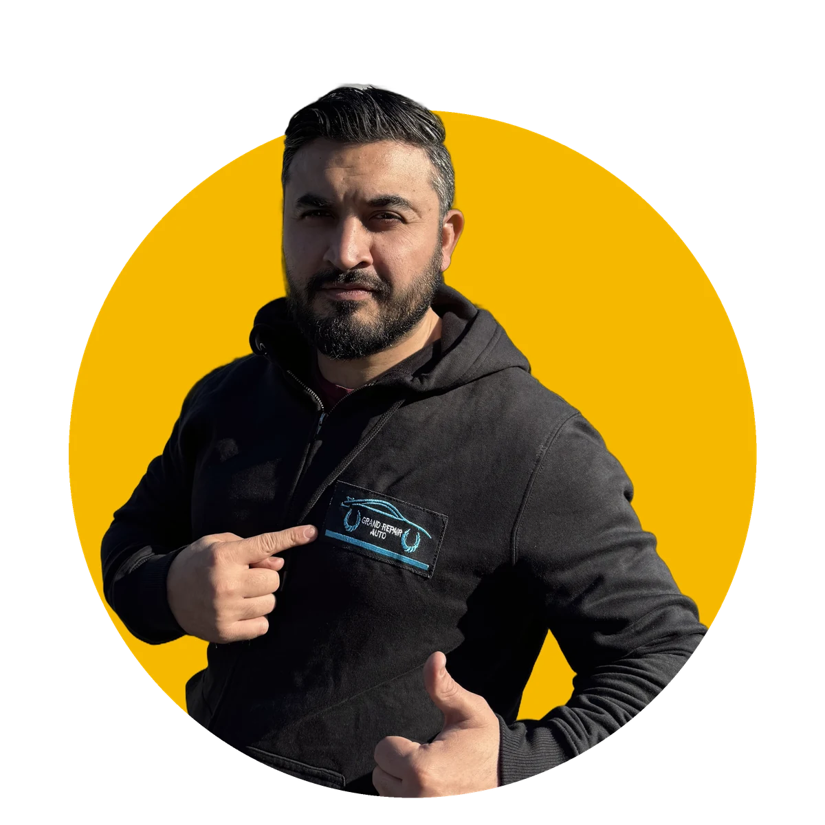 Akmal, founder of Grand Repair Auto, wearing a branded hoodie